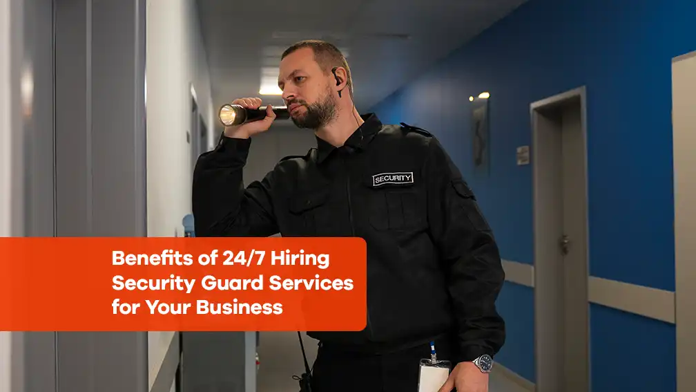 Security guard on duty in a hallway with flashlight. Text overlay: 'Benefits of 24/7 Hiring Security Guard Services for Your Business