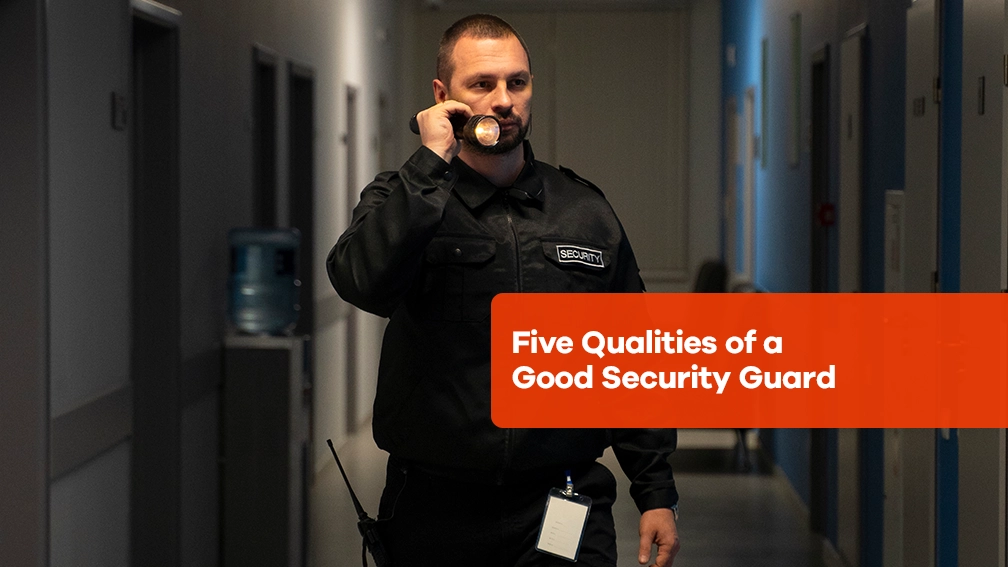 A security guard walks in a corridor with a flashlight. The text reads: "five qualities of a good security guard.