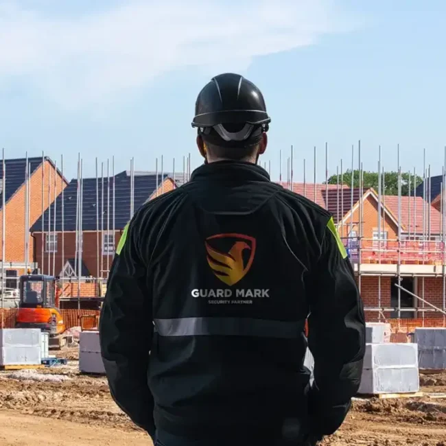 Construction site security guard performs duties at the construction site, ensuring safety and security effectively.