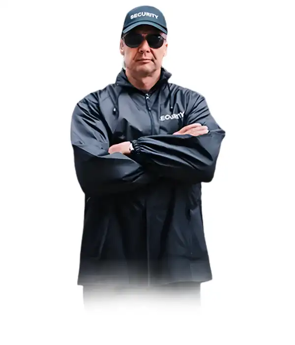 A Keyholder and alarm response security officer wearing a black security jacket, cap, and sunglasses, standing with arms crossed against a white background.