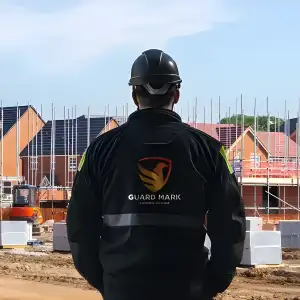 Construction site security guard performs duties at the construction site, ensuring safety and security effectively. Construction site security guard performs duties at the construction site, ensuring safety and security effectively.